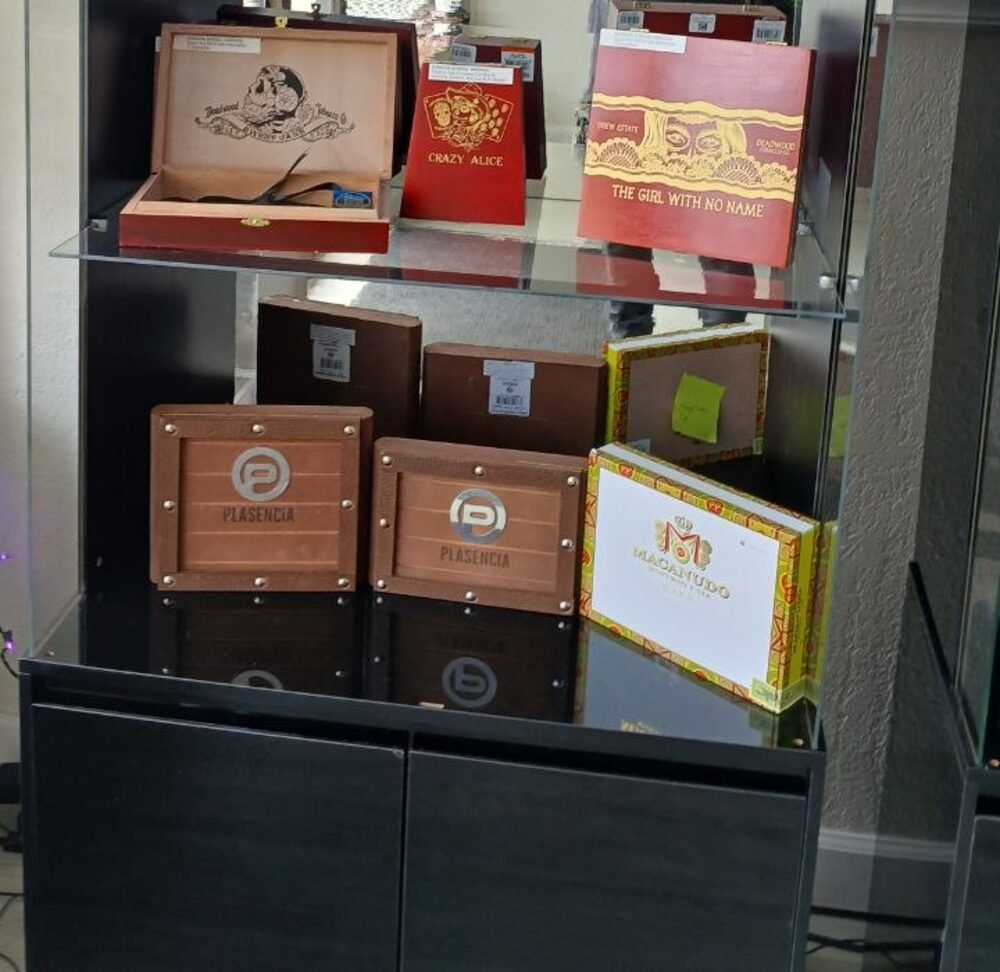 Premium cigar boxes including Deadwood and Plasencia in the humidor case